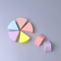 Fan-shaped powder puff, usable wet or dry, expands when wet for a makeup sponge