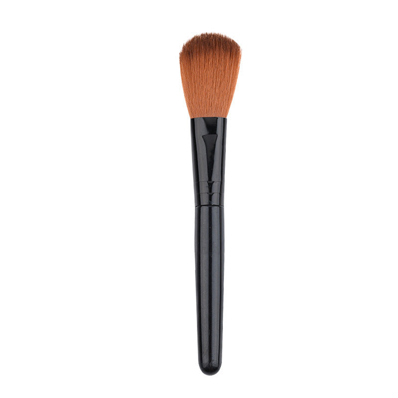 Setting makeup with a yellow powder brush