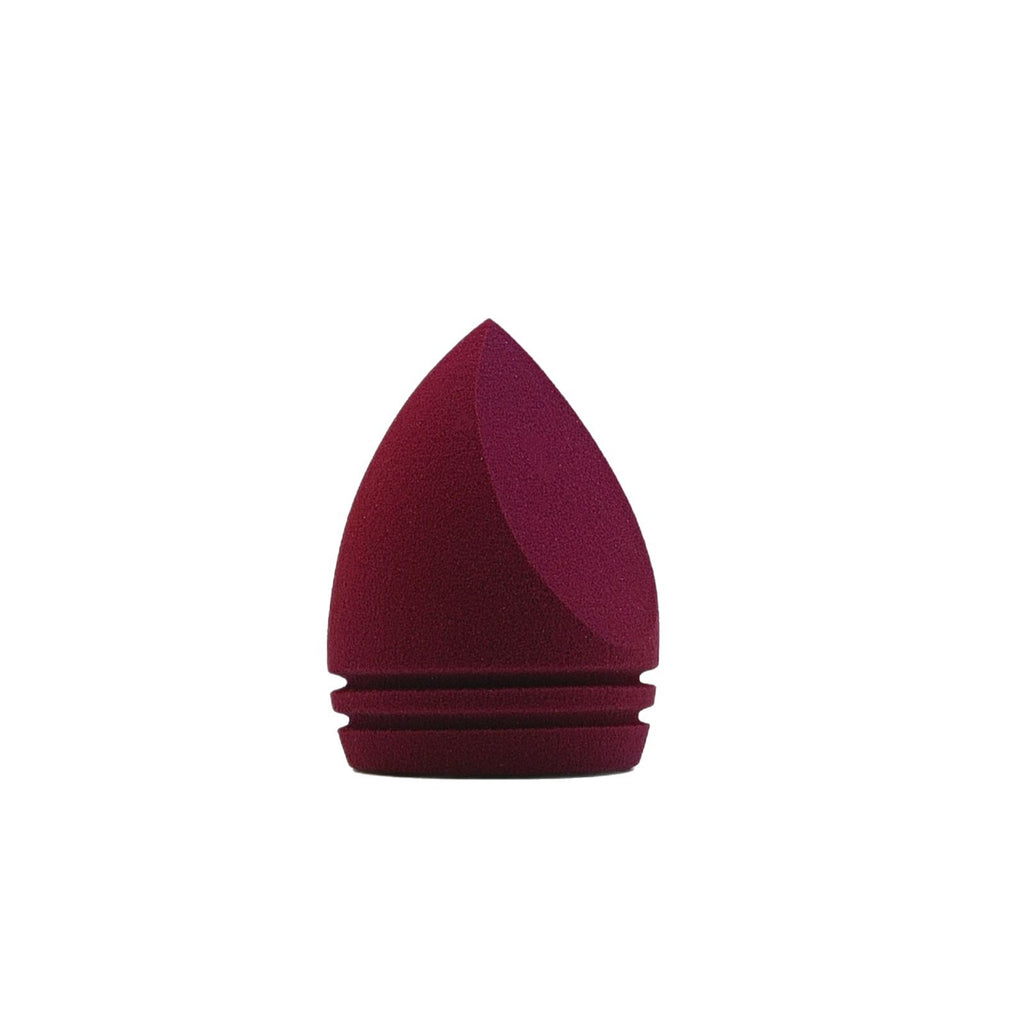 Irregularly shaped teardrop-shaped beauty sponge expands when soaked in water and can be used wet or dry