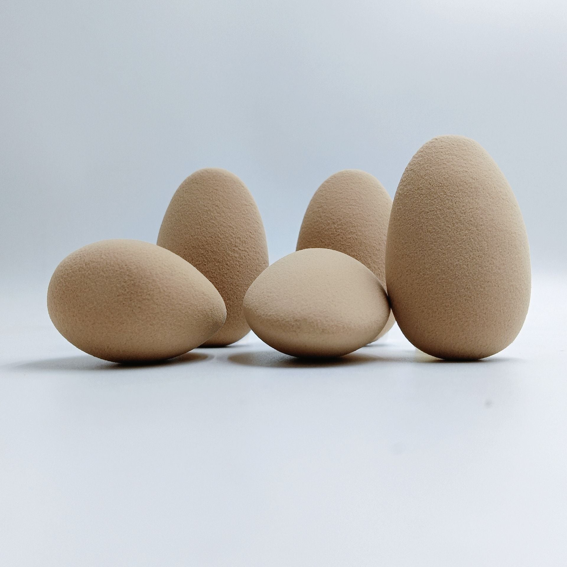 Oval-shaped makeup sponge that expands when soaked in water