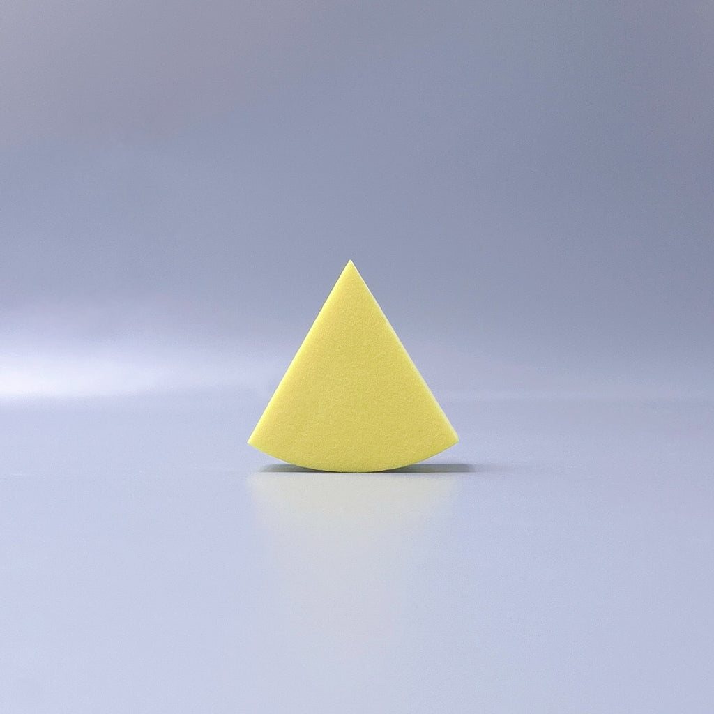 Fan-shaped powder puff, usable wet or dry, expands when wet for a makeup sponge