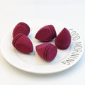 Irregularly shaped teardrop-shaped beauty sponge expands when soaked in water and can be used wet or dry