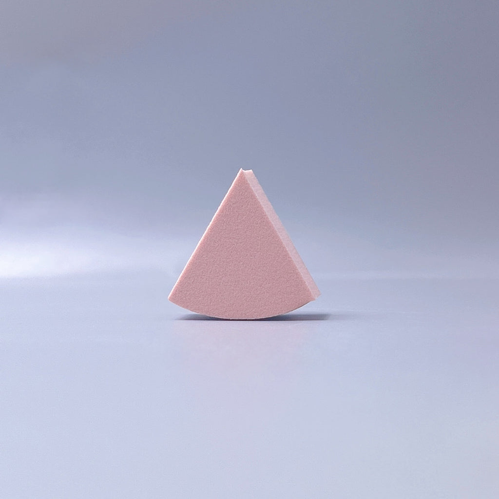 Fan-shaped powder puff, usable wet or dry, expands when wet for a makeup sponge